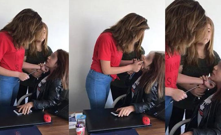 Ofisi basıp genç kızı darp ettiler