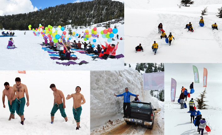 Kayak merkezi için leğenle kayıp karda güreştiler