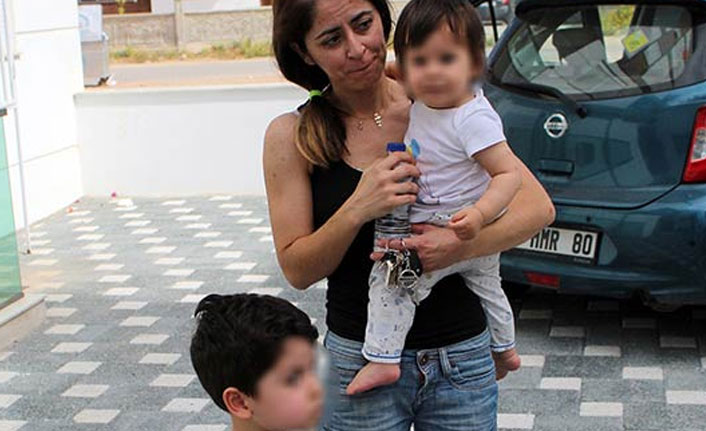 Çocuklarını yangından çekip aldı