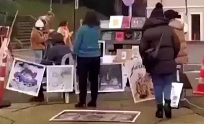 Kabe fotoğrafını yere seren 2 kişi tutuklandı