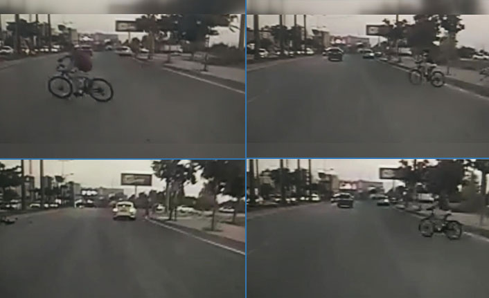 Sokak köpeklerinden kaçan bisikletli çocuk otomobilin altında kaldı