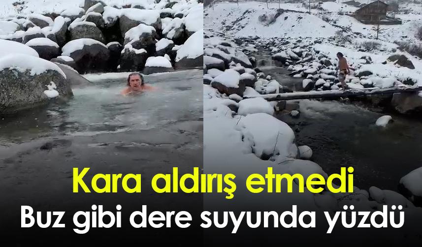 Kara aldırış etmedi! Buz gibi dere suyunda yüzdü