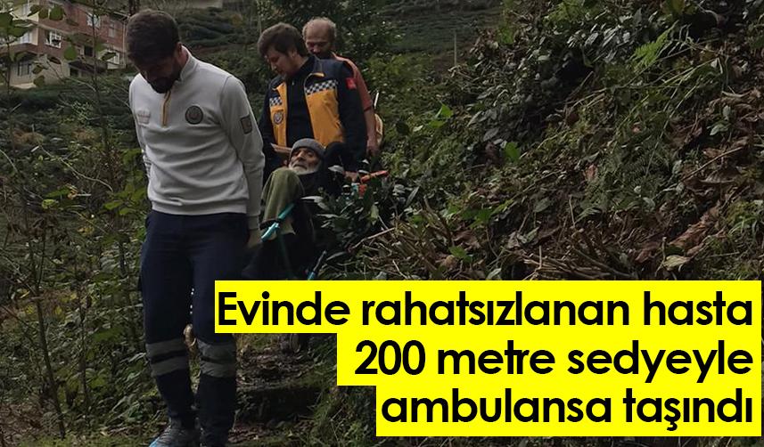 Rize'de evinde rahatsızlanan hasta 200 metre sedyeyle ambulansa taşındı