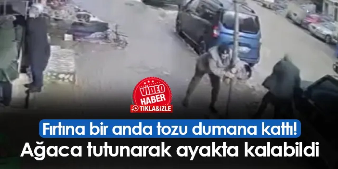 Fırtına bir anda tozu dumana kattı! Ağaca tutunarak ayakta kalabildi